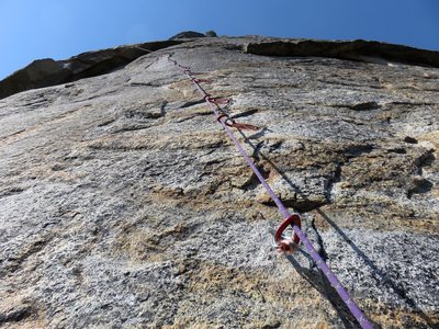 Pitch 5. This is the crux pitch of the route, face climbing on tiny edges. It is tightly bolted. Done free, it is 10c. As a bolt ladder, it is 5.9 A0. When the FA'ers put up this nine-bolt ladder in 1954 it was the longest bolt ladder in the country.