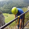 The fence at the top of the crag. It's solid. Secure yourself and then belay your follower off it. There's a nice wooden bench to chill at from where the photographer is standing. Have a snack and drink and enjoy the view before rapping. 