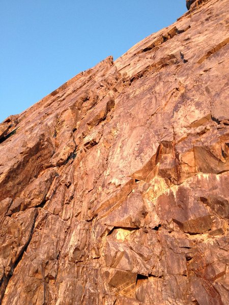 Looking up the first two pitches of the direct start to Clyde Minaret's SE Face route. 