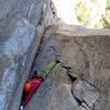 Pitches 6-8. A climber nearing the top of the first pitch in the corner (this would be midway through Pitch 7 on the SuperTopo). He also belayed where we did, although he had to take a hanging stance until we vacated.