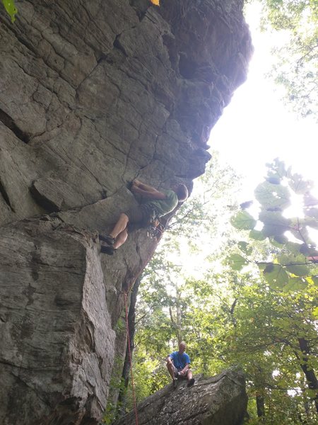 Keith starts up Spank Me.  Climber stays on the left side of arete and clips all bolts on their right side.