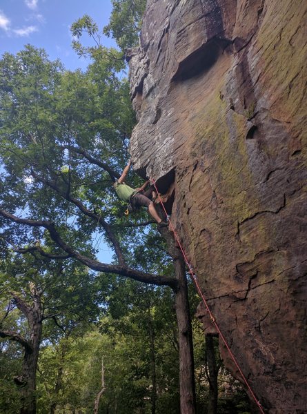 Keith is farther up the arete and is just about to get into the crux.