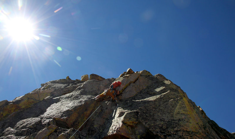 Ryan getting into the slightly overhung handcrack on lead up pitch 4.