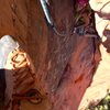 Looking down from the belay at Emma inside the Coke Bottle, preparing to finally emerge.