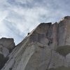 Climber in pink is on 5.7 Book, with Cat Scratch Fever to the right. Climber on the horizon is near the top of 5.8 Hand Crack.