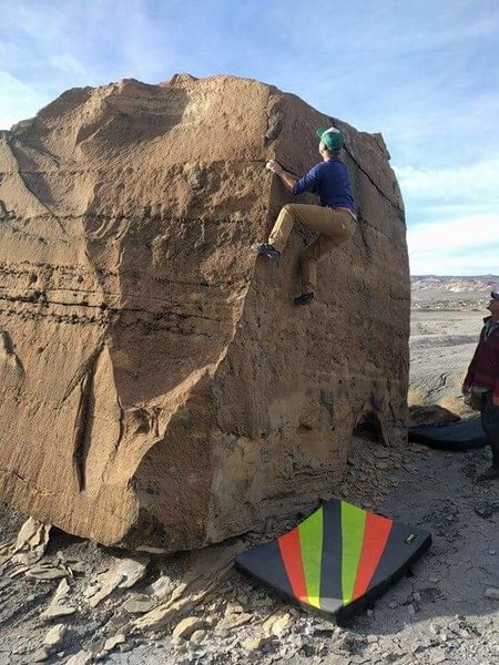 Climbing the lady boot on the circuit boulder