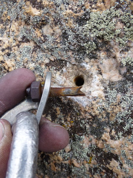 Third pro bolt on pitch 4 - the end snapped off in the hole, necessitating a new hole (old hole was patched).