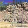 Cattle Call Wall (left side).  All routes are shown (except bouldering routes) and are listed from left to right in numerical order and color coded for clarity.