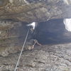 If you swing to the opposite wall and climb up that way, you'll be on Little Creatures.  This photo shows Wic laybacking the flake on Little Critters.  Fun climb with a scary (if your afraid of heights) move at the top.