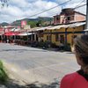 Street view in the heart of things, showing Rica Pizza and the climbing shop. To access the railroad tracks and cliff, go down the alley by the white sign. Downtown Suesca is to the left of the photo, about a 20 minute walk.