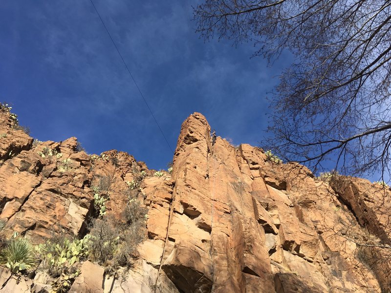 Upper portion of the route, with a climber (Michael Briseno) at the chains.