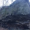 The overhanging side of the boulder. The bottom has mostly solid rock, with a little bit of choss.