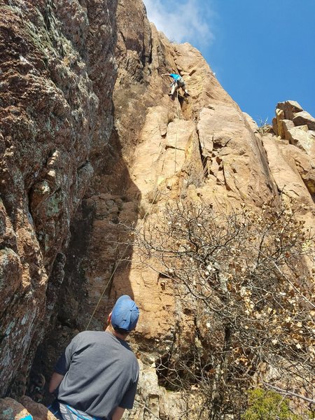 Michael is approaching the crux near the top of the route.