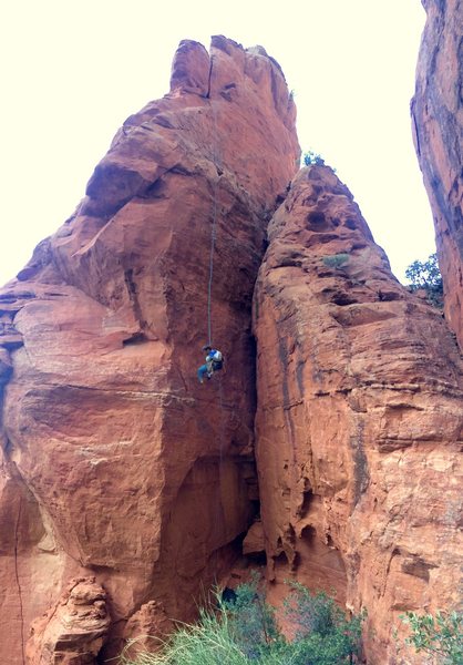 Bean rappelling the normal route on the Dorsal Fin. See route page for topo overlay.