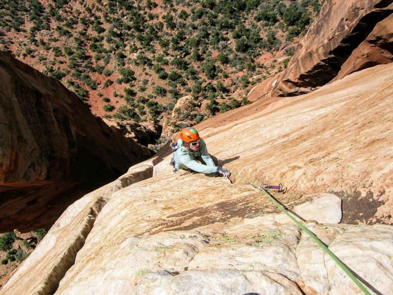 Neil Kauffman finishes up the 5.9 flake on P5 of Lovelace with the Fang Spire behind left.