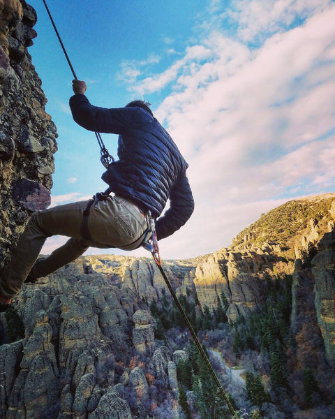 Nate Layton repelling down Fish Pin.