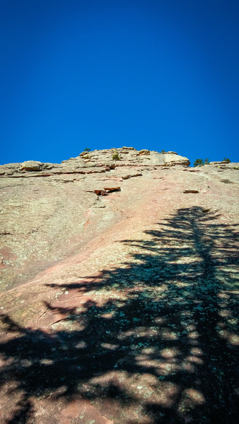 At the base of the Direct Route. The tree at top of first pitch is visible.