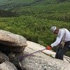 Starting our 3rd rap with single 70m rope; note the back-up sling attached to a #1 Camalot