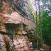 An unknown climber climbing the first pitch of Grim-Ace Face barefoot on June 9, 2017.