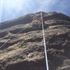 Practicing lead while on a top rope belay. This photo shows where the bolts and anchors are located.