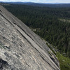 Looking across some flawless granite to where Friction Affliction and Ice House Roof come up.