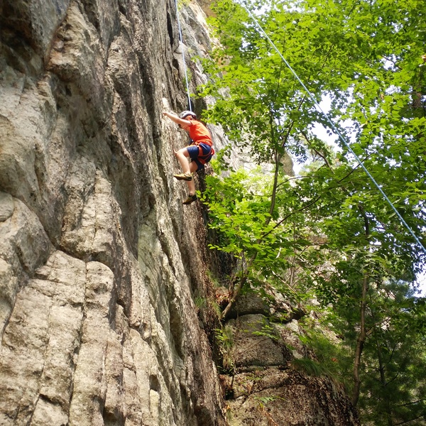 View from the alcove of Easter Time Too of Damian, age 5, carefully picking his way up.  This climb works well for those shorter of stature.