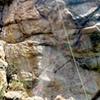 The crux starts at the bolt and clip, where the rope crosses, all the way out and up to the first piece in the vertical crack.