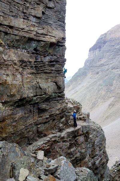 Climbers starting up Cardiac Arete. To get to the base of the route, traverse in on the obvious ledge.