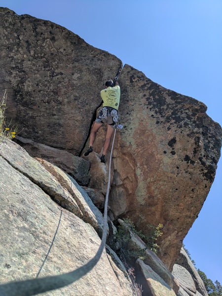 Tony B. warming up for the day on the FA (presumed) of 'Give Me a Break' (5.10d?) on the Lower/Left Breaks.