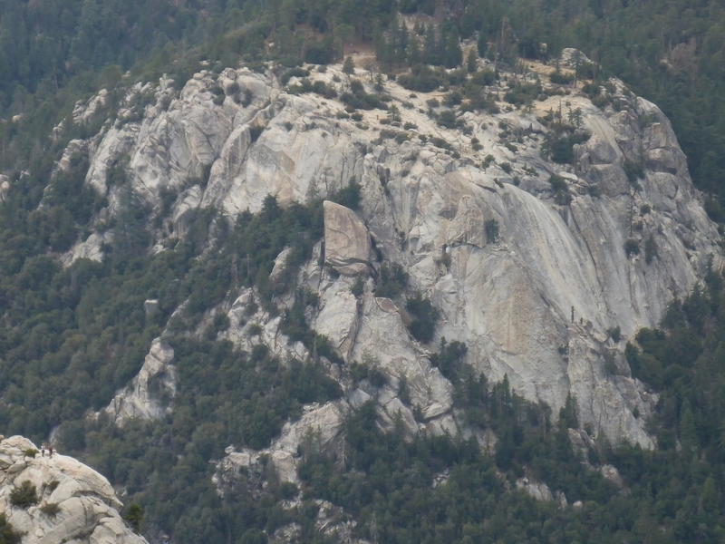 Zoomed in shot of two climbers on Tahquitz's summit in the lower left hand corner and Suicide Rock.