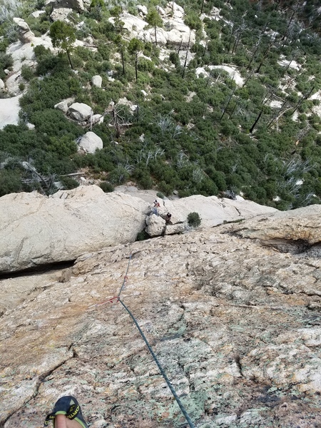 Looking down onto the belay from near the top of pitch 2