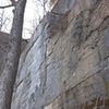 The Lower Misery Wall. The entry path is above it. The Upper Misery Wall also seen here higher up is off limits to climbing.