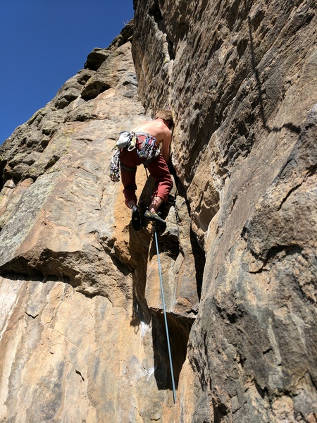 About to hit the ledge on the left and a solid rest before tackling the short but excellent finishing crack.