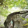 Chris Grasinger standing tall on "Salute" at the Roadside Boulder, Left Boneyard, GHSP