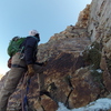 If done as 3 pitches, this would be the start of the 2nd pitch. Climb to top of slab and make way to right ledge (about 5' by 7'); not my favorite belay station, but it works if you want to finish in 3 pitches.