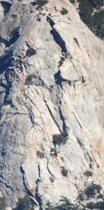Photo of Tahquitz Rock, with the Fingertip Traverse route drawn on top. The photo is one I took with a 300 mm lens from the highway near Pine Cove.