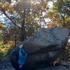 Starting up the classic arete line “Riptide” on the west end of the Back Door Boulder #1.