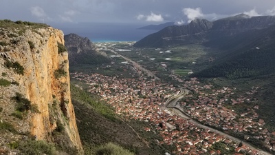 Looking down on the town of Leonidio and the Aegean Sea from the top of the massive limestone walls north of the town. November 2017.
