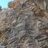 Thomas Pham climbing the route. After TRing it, he successfully led it on trad gear (maybe 5-6 cams place, including a shiny new red Alien).