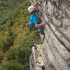 Nick pulling just after pulling "the move", with Becca at the belay.