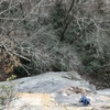 Looking down from the belay ledge.  Alec has just climbed the splitter and is about to traverse to the corner.