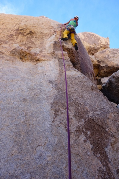 The first half of the route climbs patina on the arete.