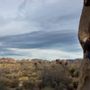 Mark leading Left Baskerville with moody skies