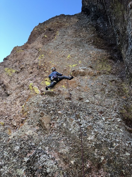 Alex testing the holds on the pumpy crux section of P1.