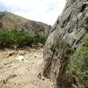 San Ysidro - May 28, 2018
<br>
Wesley Fienup climbs the start of Face Lift. The crack along the first 20 feet of the route is packed with mud, making it feel slick and insecure. Above the oak tree that now rests against the wall, the rock quality is fine.