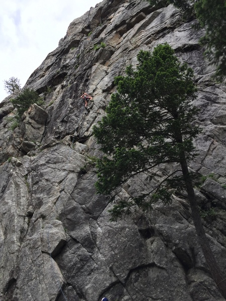 Climber near crux 2/3rds up P1.