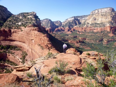 J. Burcham soaks it all in from the summit of The Earthship.