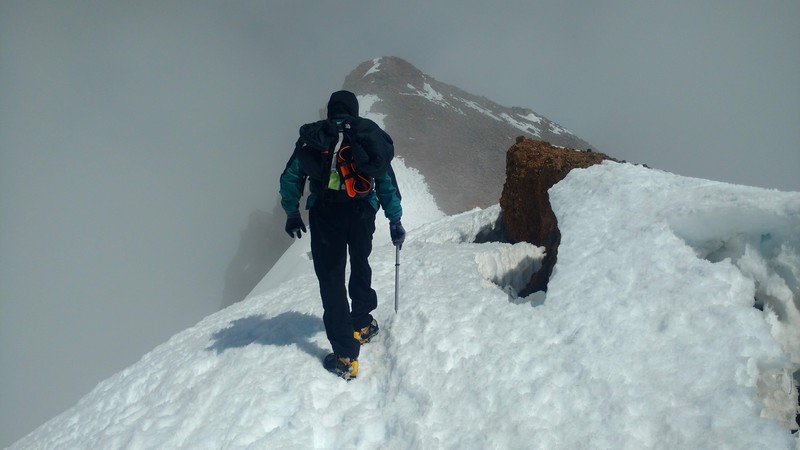 Dan George of Santa Barbara on the easy but exposed narrow ridge spot right after surmounting Avy Gulch. (See comment.)