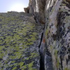 looking up the magnificent tight hands crack on P1. This to pulling the overlaps made for great climbing, albeit a little grungy