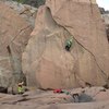 Kelly using the flake to the right of the distinct line of Dosethrisset, which splits the middle of the boulder.